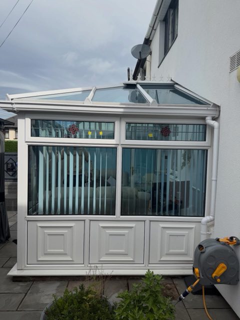 Before: White UPVC conservatory before spraying