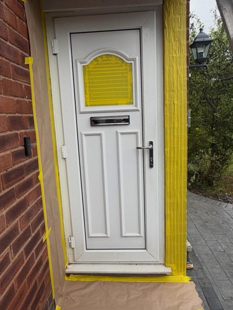 Before: White UPVC front door masked up ready for spraying