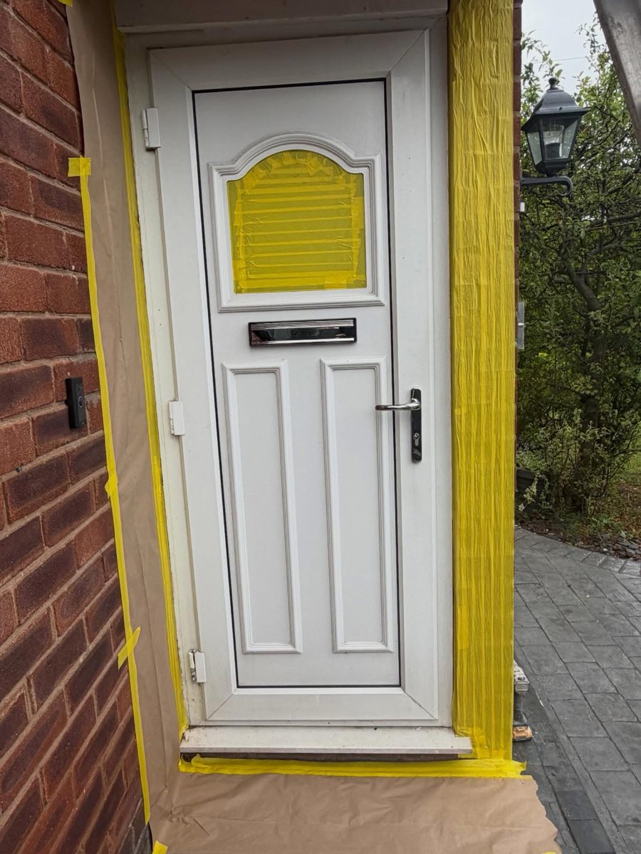 Before: White UPVC front door masked up ready for spraying