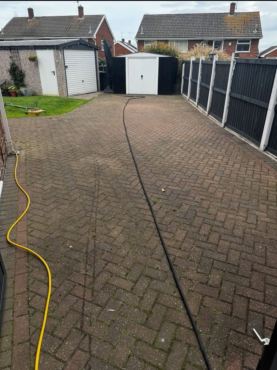 Before: Dirty, weathered block paving driveway